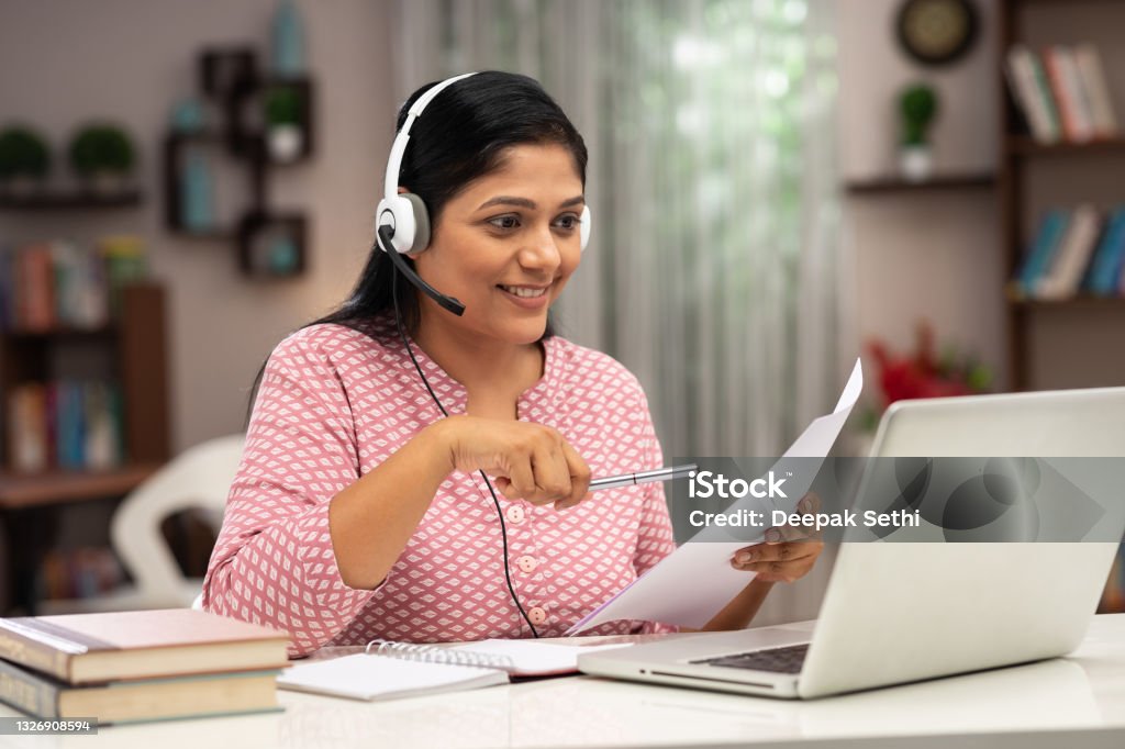 A woman taking online classes for best online degrees for working professionals.